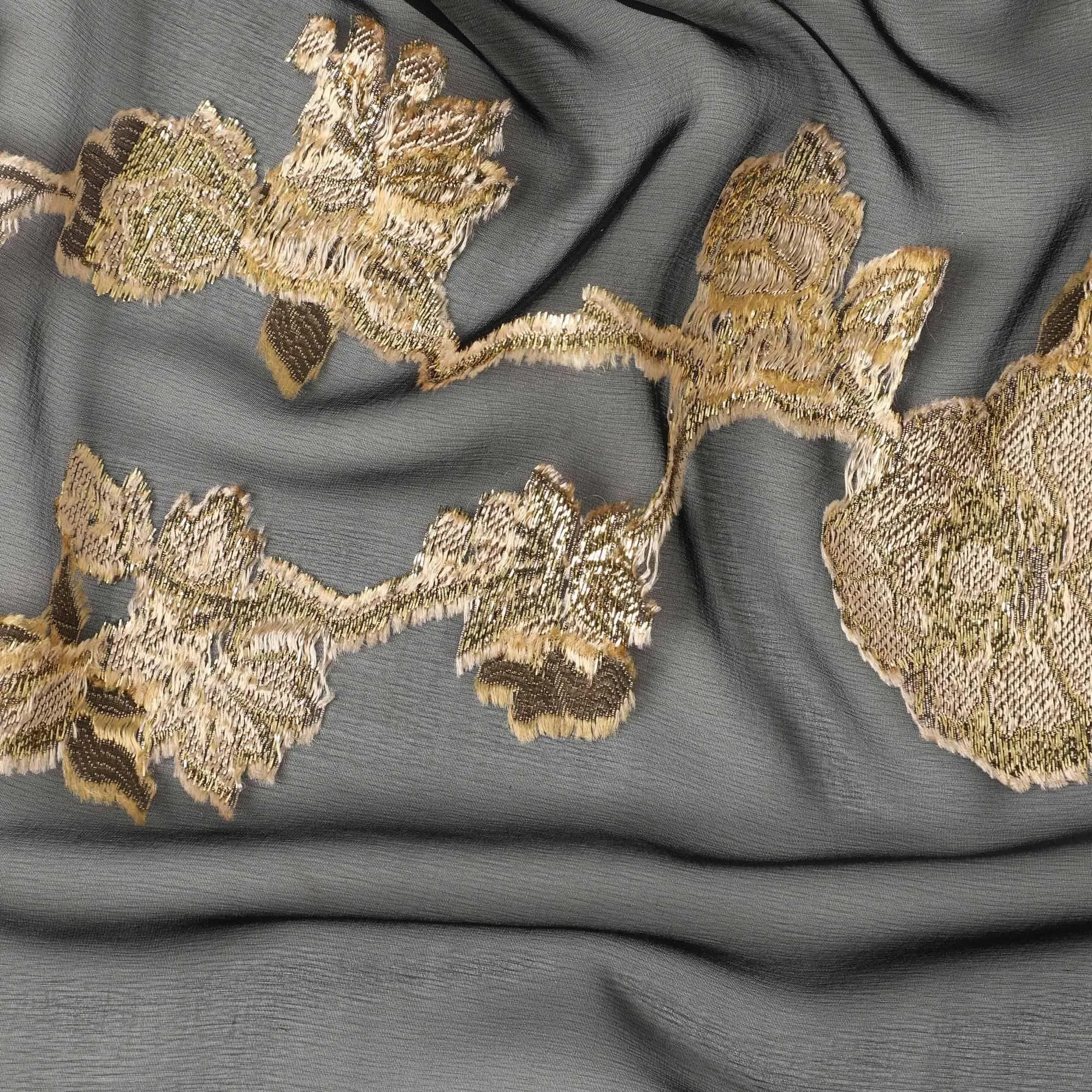 Black French silk chiffon fabric with beige, gold viscose and golden metallic lurex in floral design