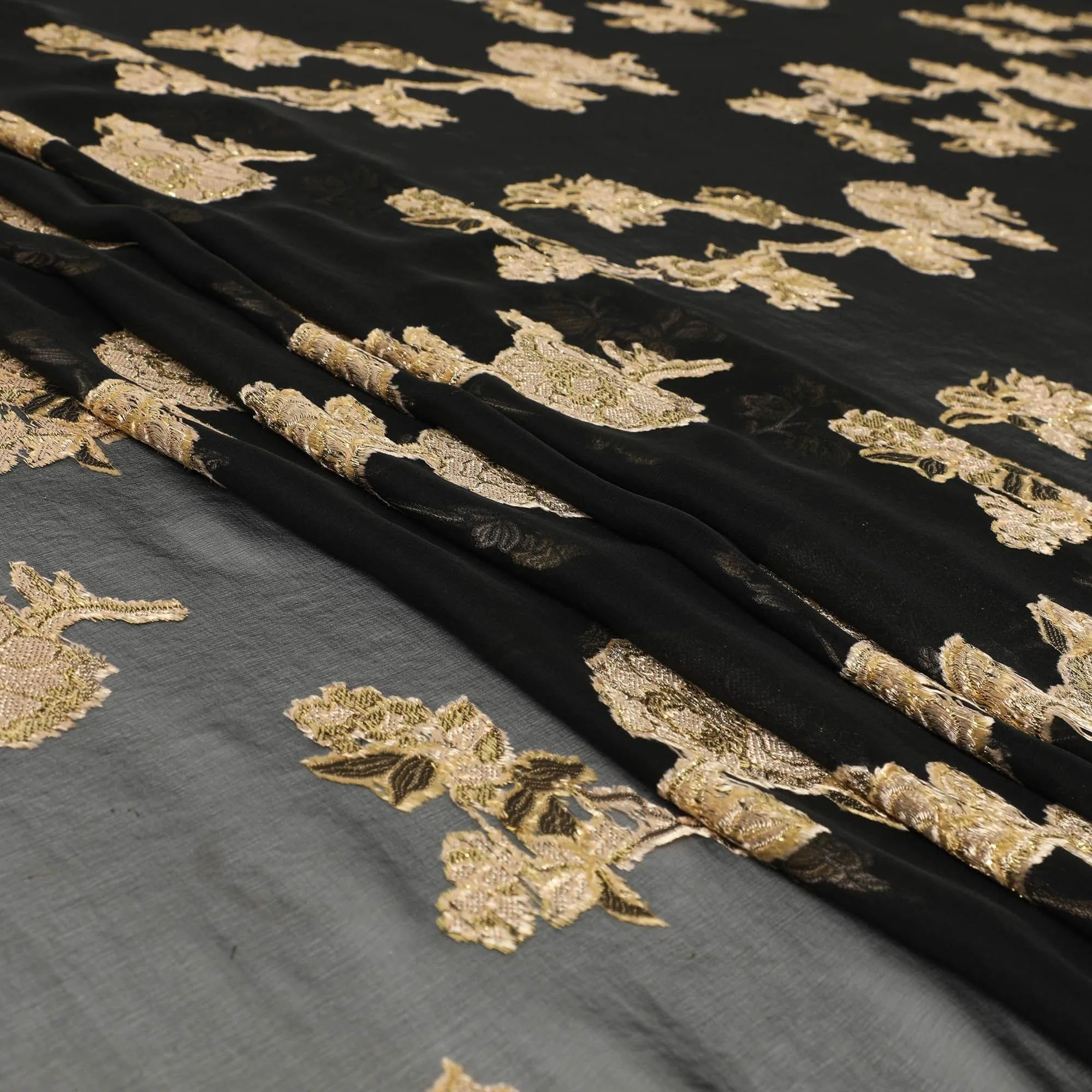 Black French silk chiffon fabric with beige, gold viscose and golden metallic lurex in floral design