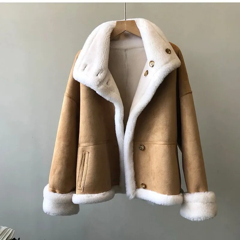 Winter luxury: faux leather shearling coat lined with real sheepskin. Double sided. for maximum warmth and style. Handmade