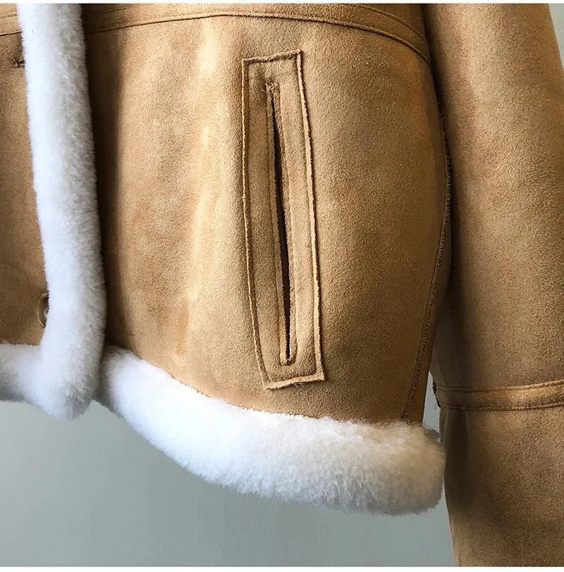 Winter luxury: faux leather shearling coat lined with real sheepskin. Double sided. for maximum warmth and style. Handmade